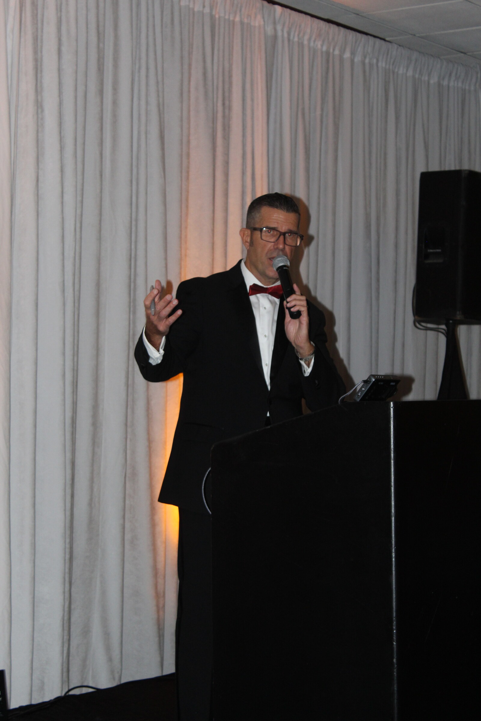 Brett addressing guests before the evening program