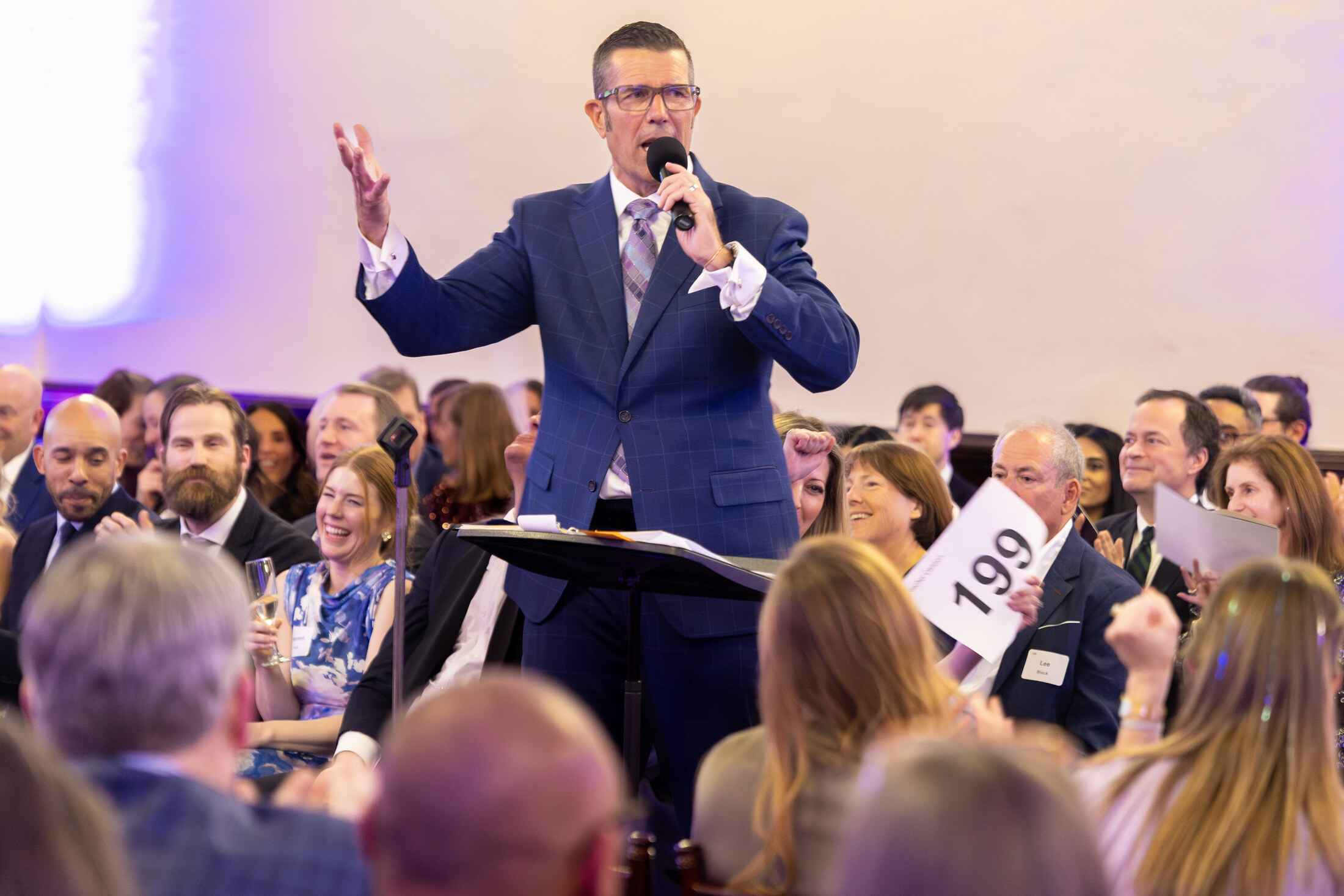 Brett connecting an event's story to its live fundraising moment
