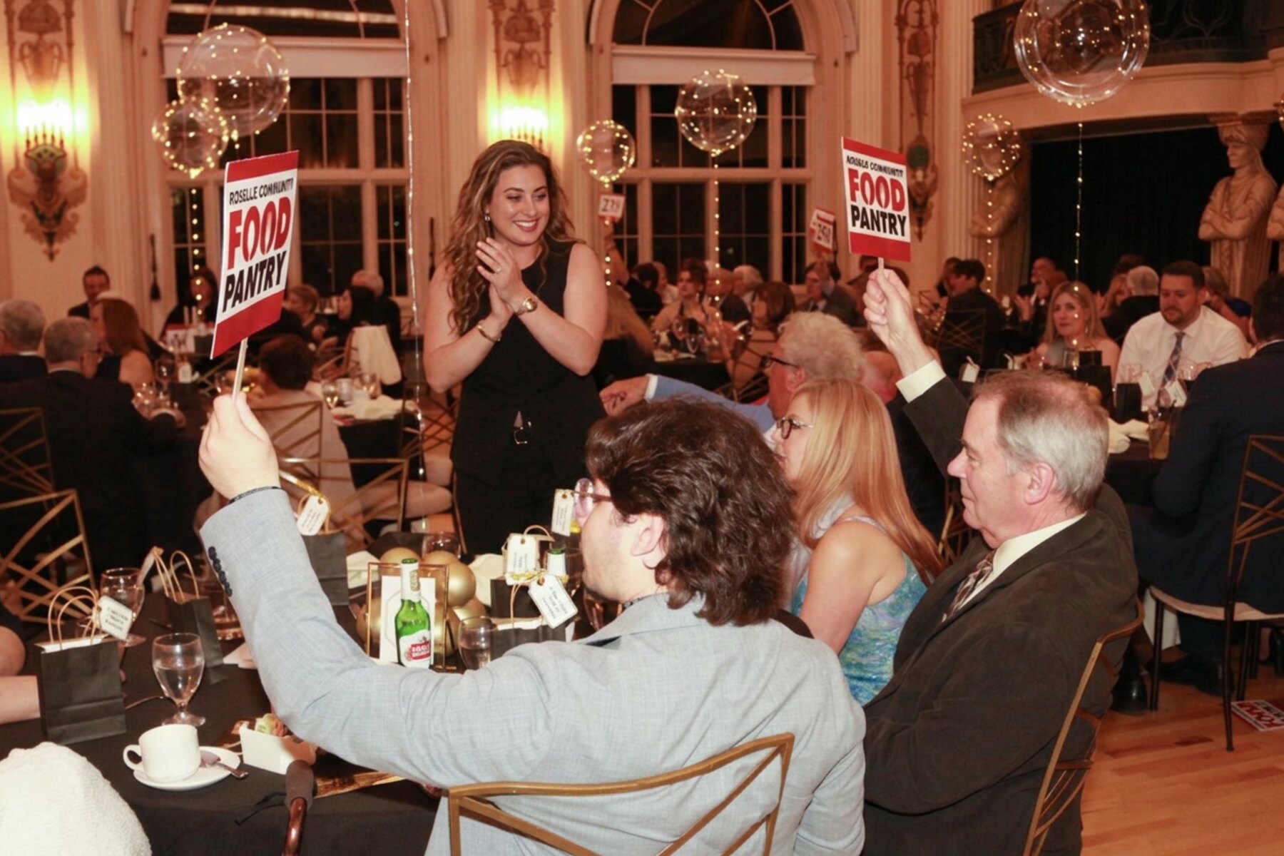 Bringing energy to the room during the live auction.