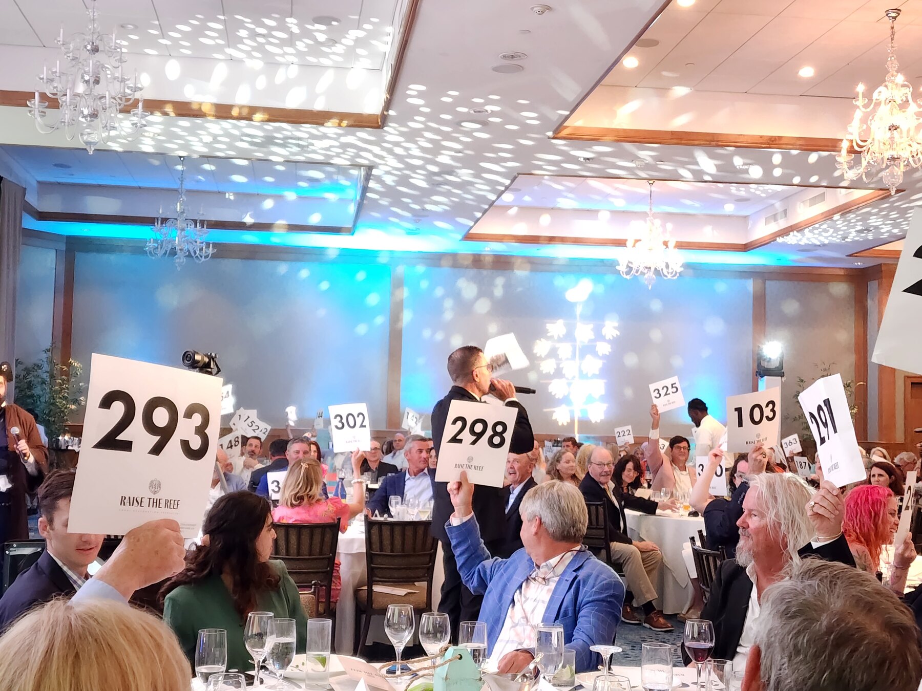 Every card up as the whole room joins in.